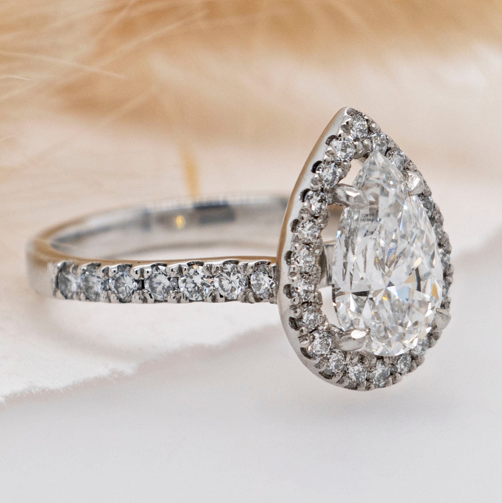 1.01 Carats Pear Shape Moissanite Halo & Pave Engagement Ring