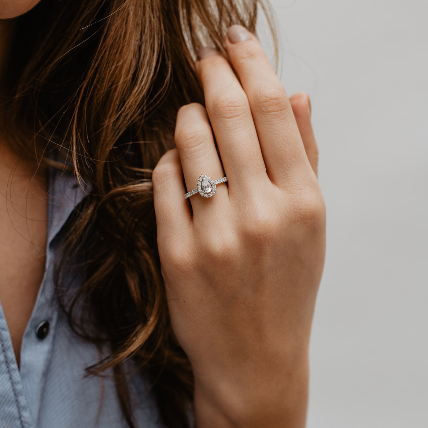 0.95 Carats Pear Shape Moissanite Halo & Pave Engagement Ring