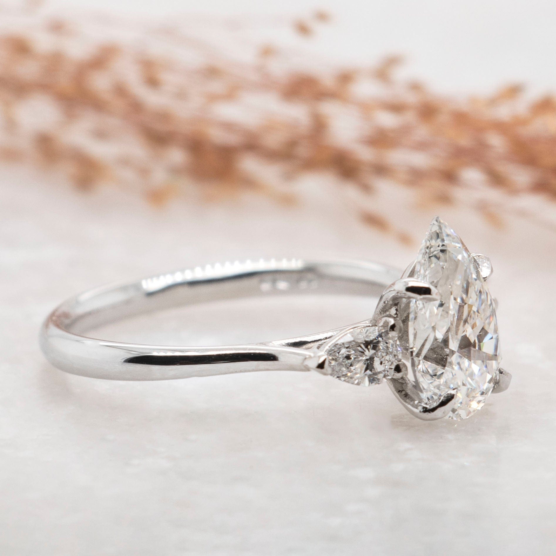 1.50 Carats Pear Shape Moissanite Three Stone Engagement Ring