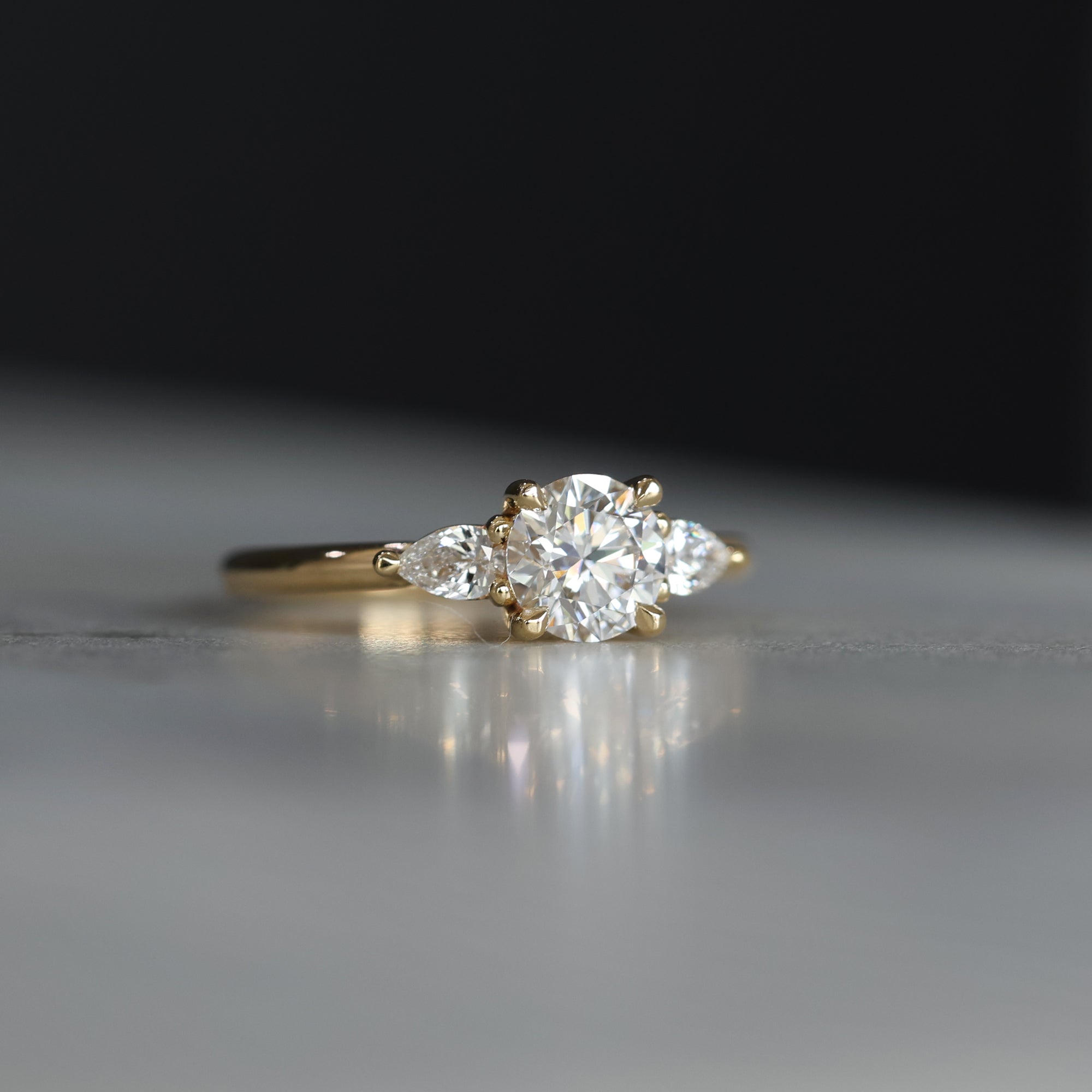 0.84 Carats Round Shape Moissanite Three Stone Engagement Ring
