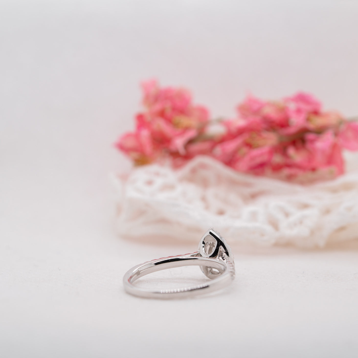 0.95 Carats Pear Shape Moissanite Halo & Pave Engagement Ring