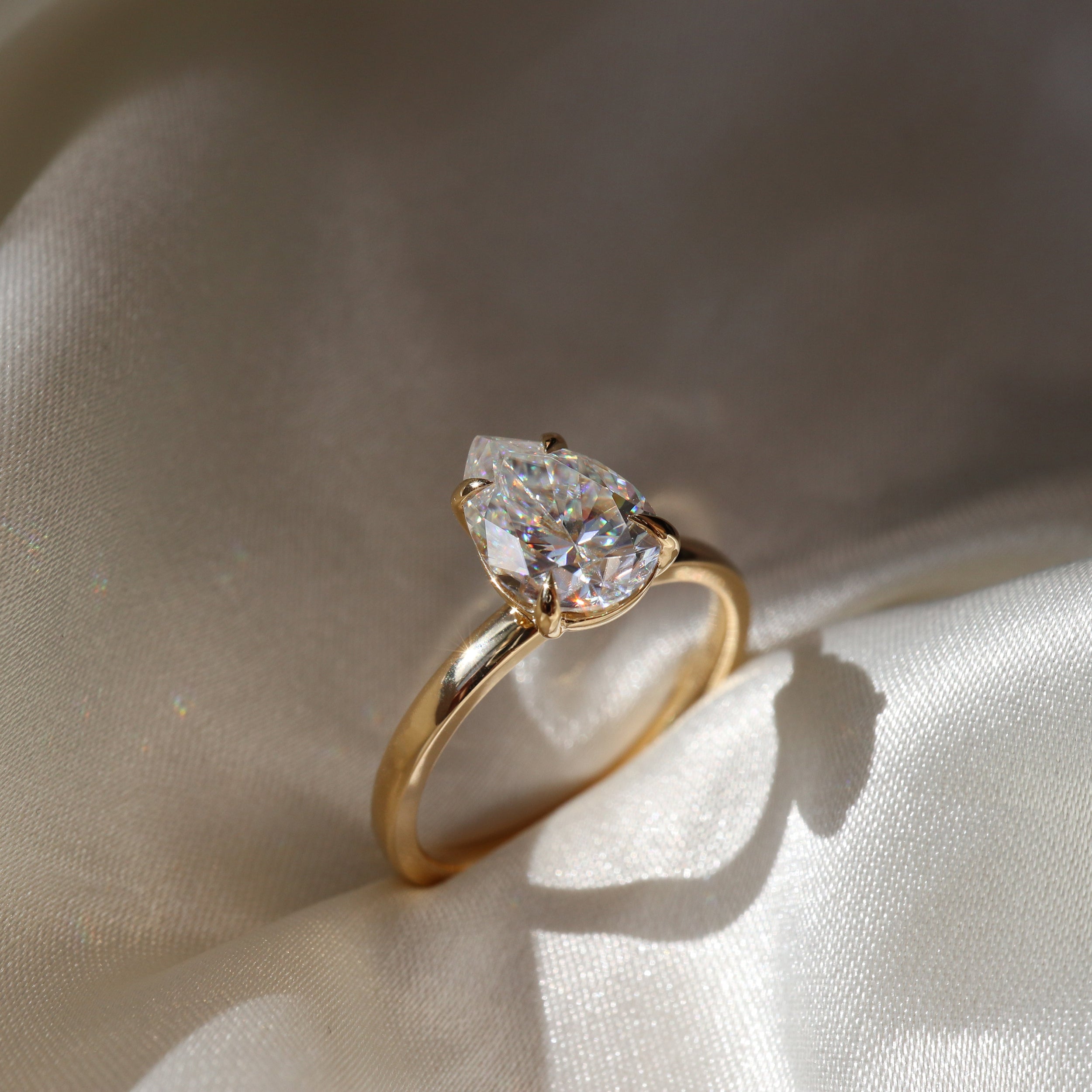 1.30 Carats Pear Shape Solitaire Moissanite Engagement Ring