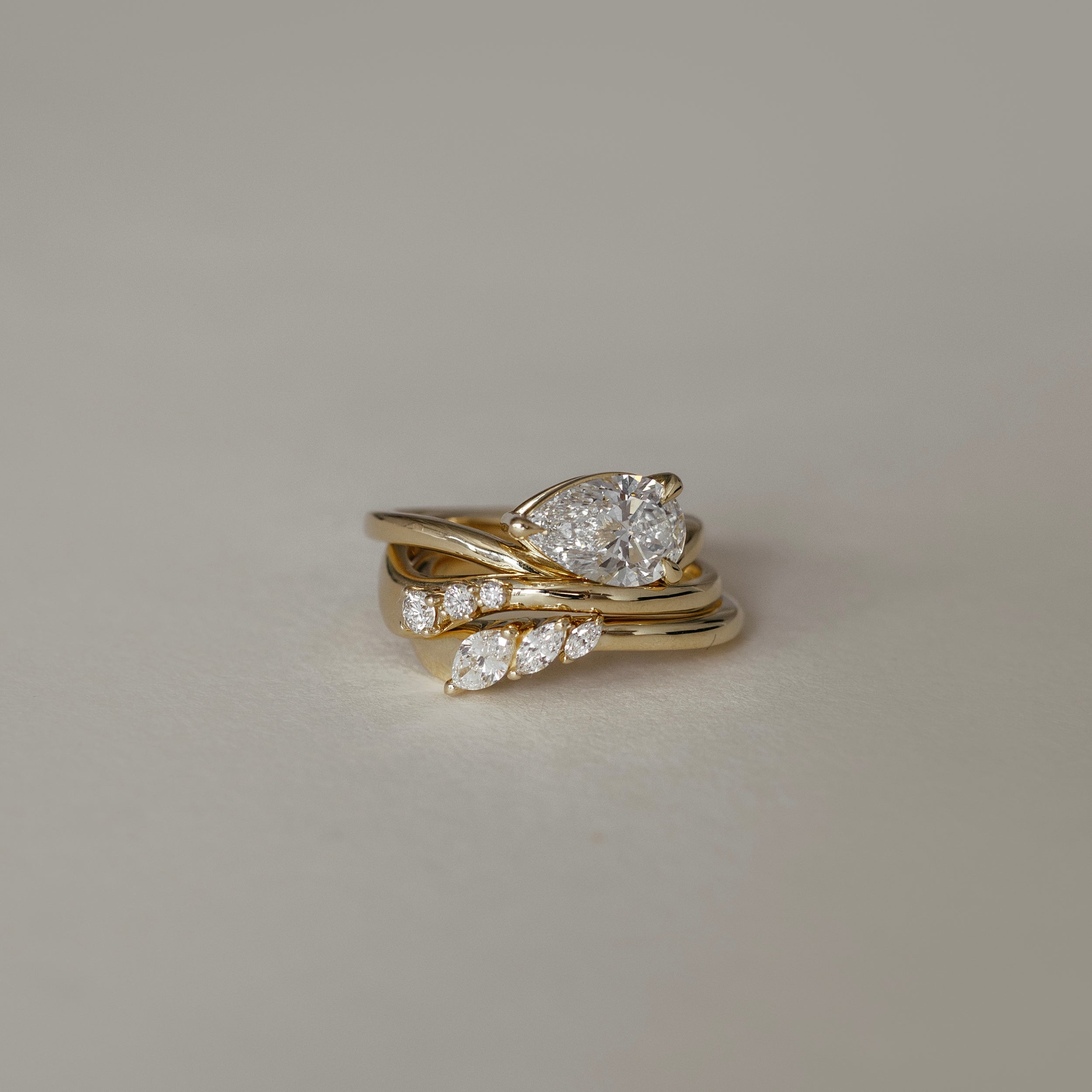 1.40 Carats East-West Pear Shape Moissanite Curved Solitaire Engagement Ring