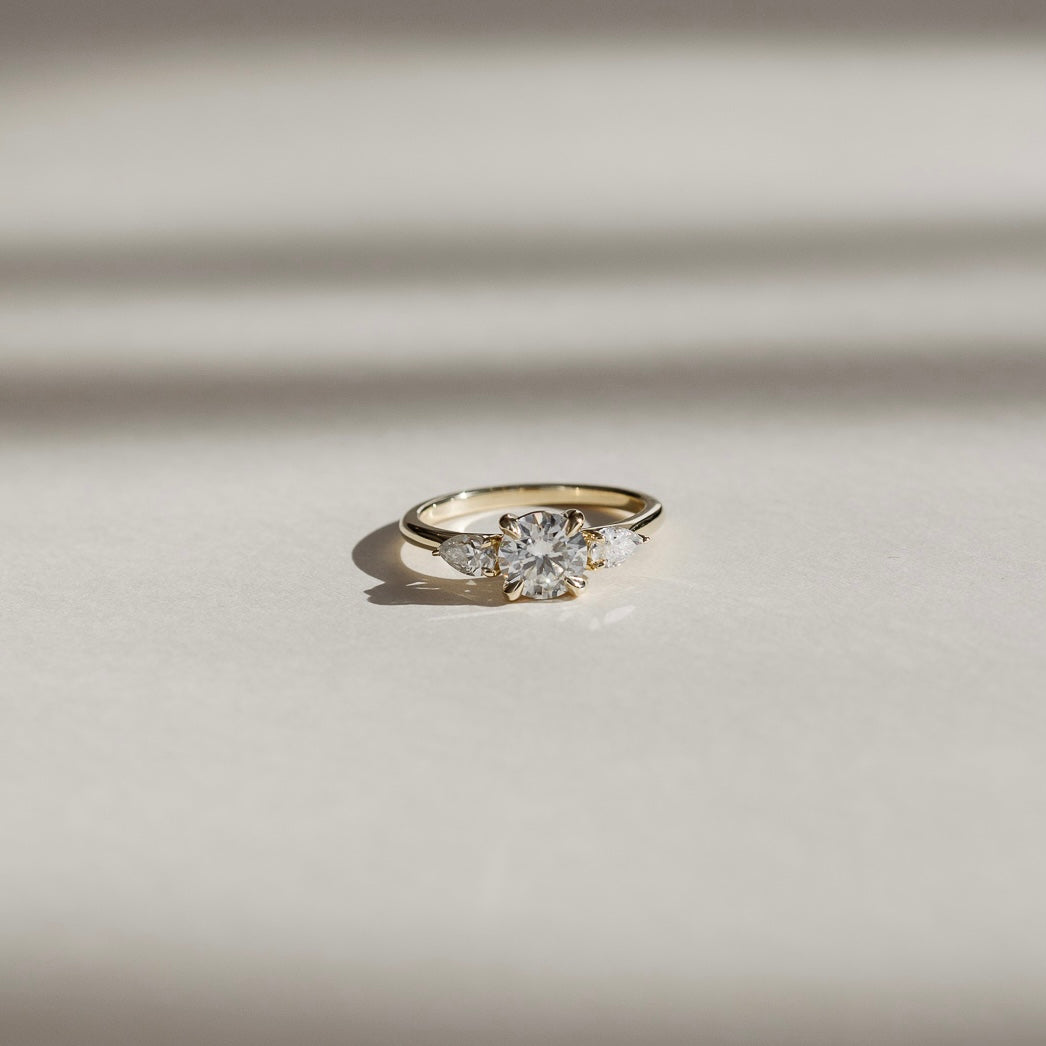 0.70 Carats Round Shape Moissanite Three Stone Engagement Ring