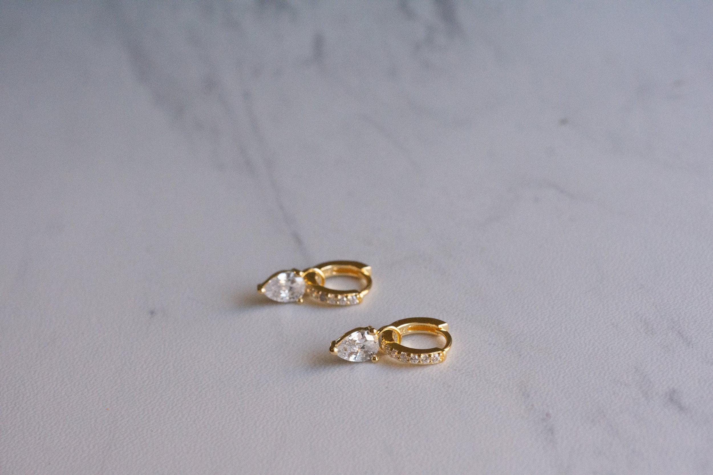1.25 TCW Pear Shape Moissanite Huggies Earrings