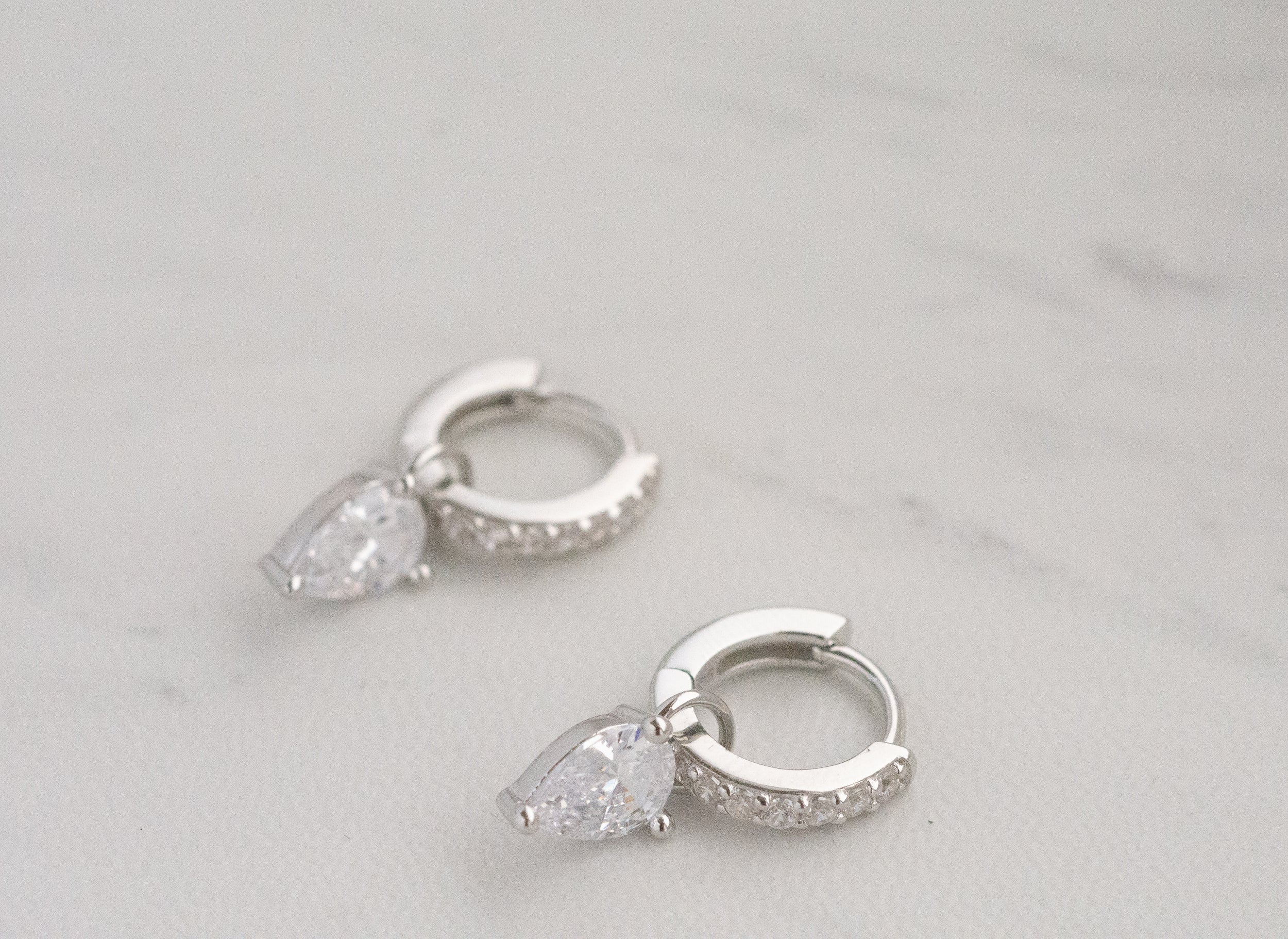 1.25 TCW Pear Shape Moissanite Huggies Earrings