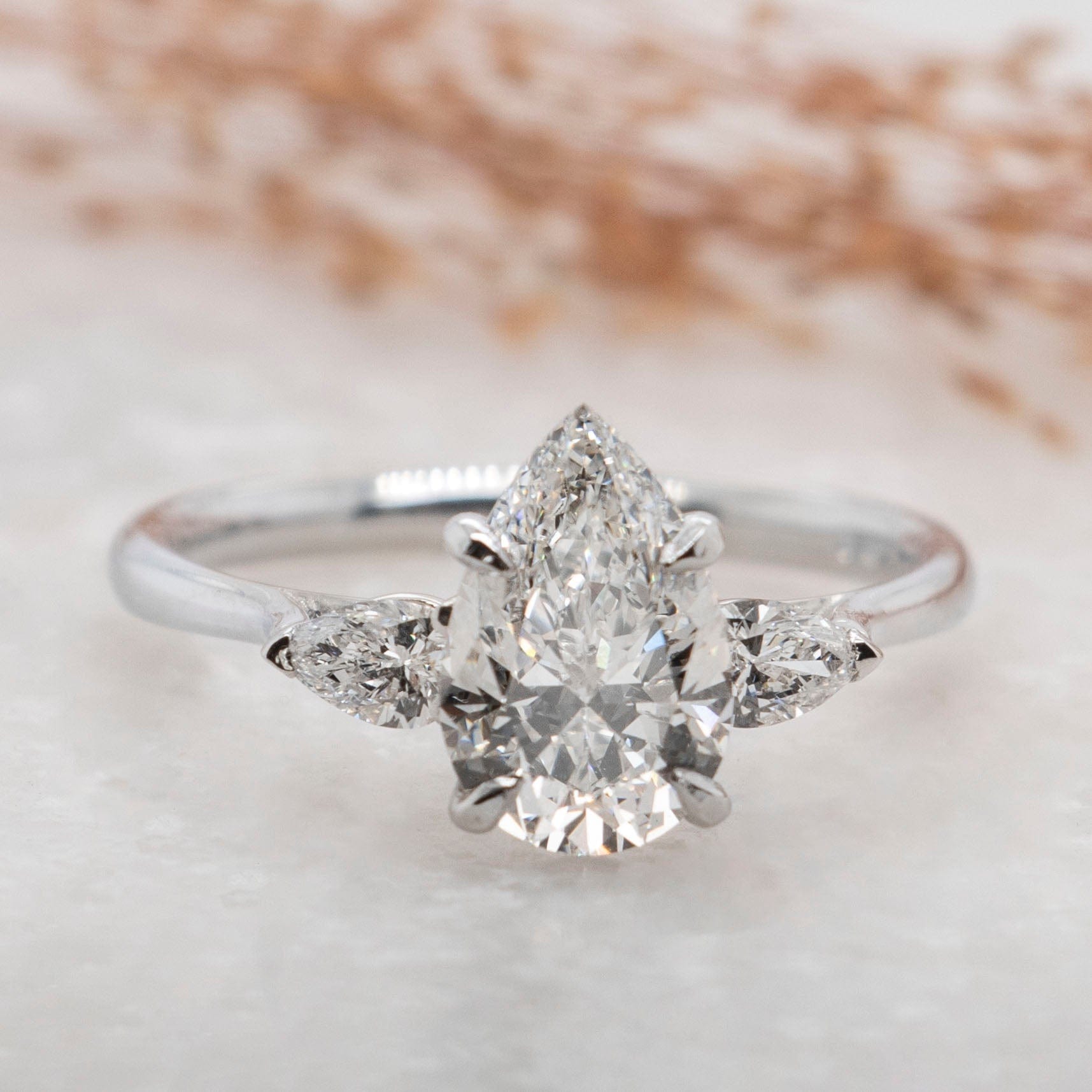 1.50 Carats Pear Shape Moissanite Three Stone Engagement Ring
