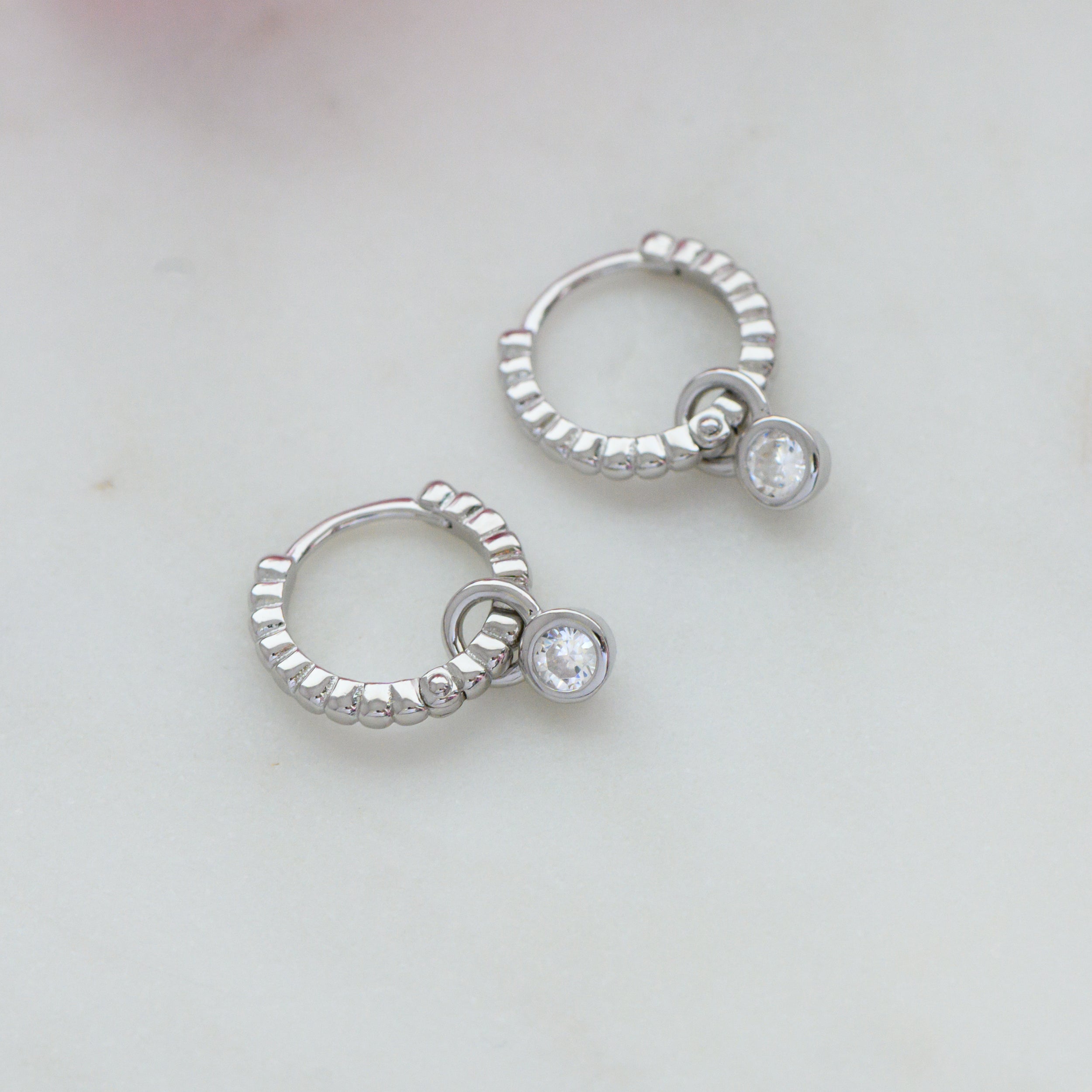 0.15 TCW Round Shape Moissanite Bezel Huggie Earrings