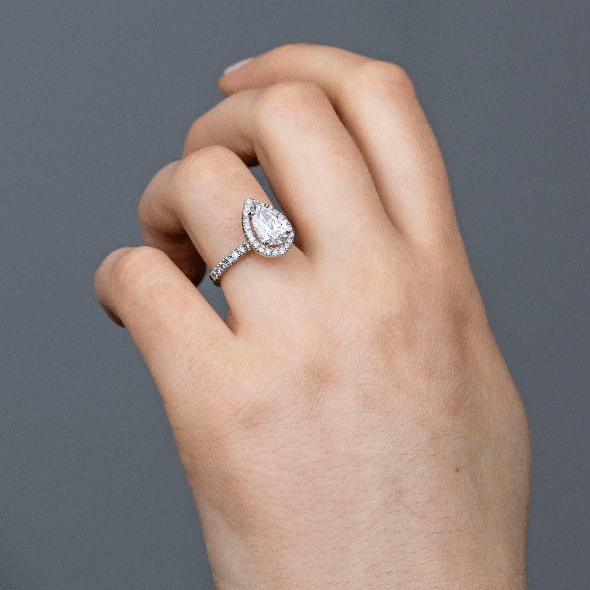 1.01 Carats Pear Shape Moissanite Halo & Pave Engagement Ring