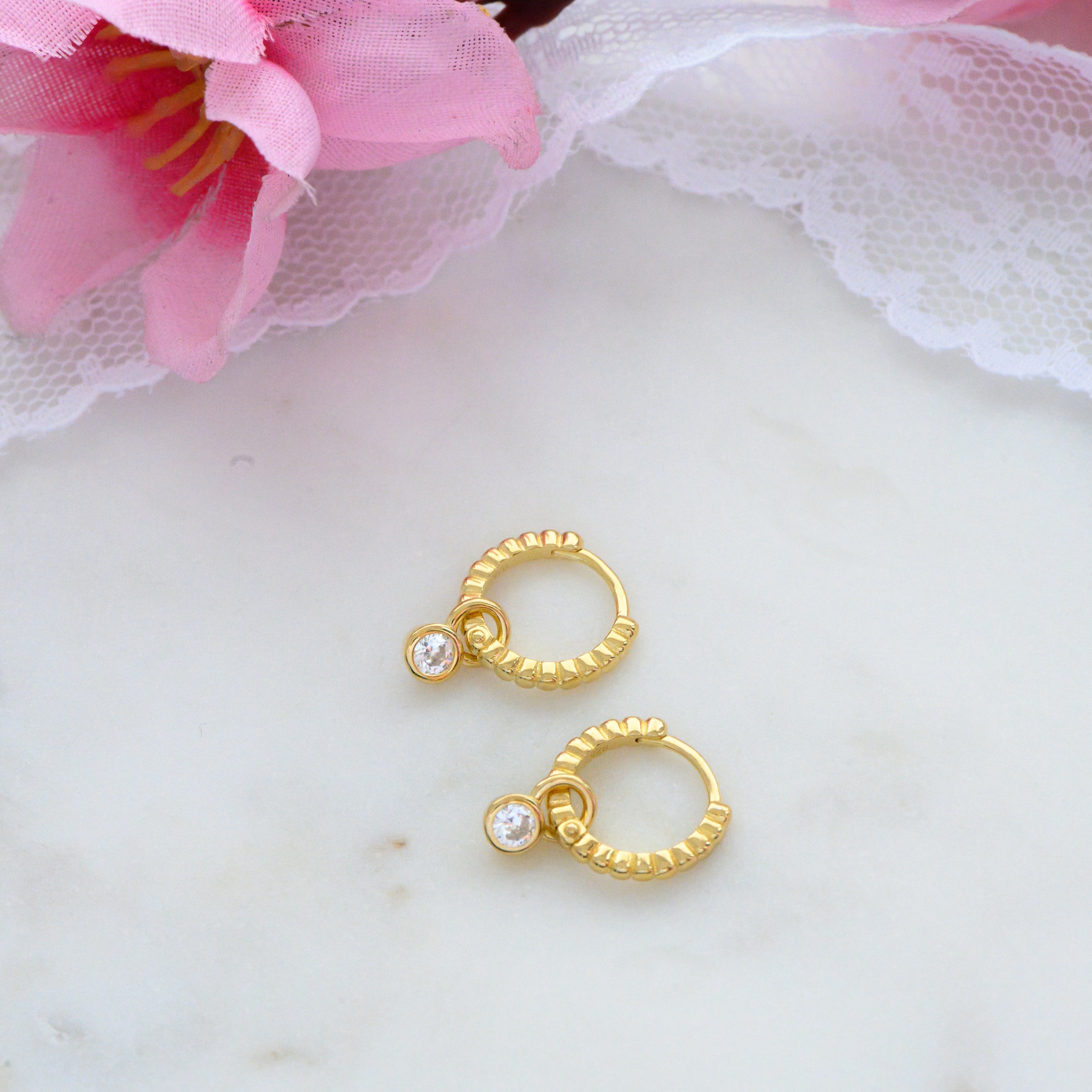0.15 TCW Round Shape Moissanite Bezel Huggie Earrings