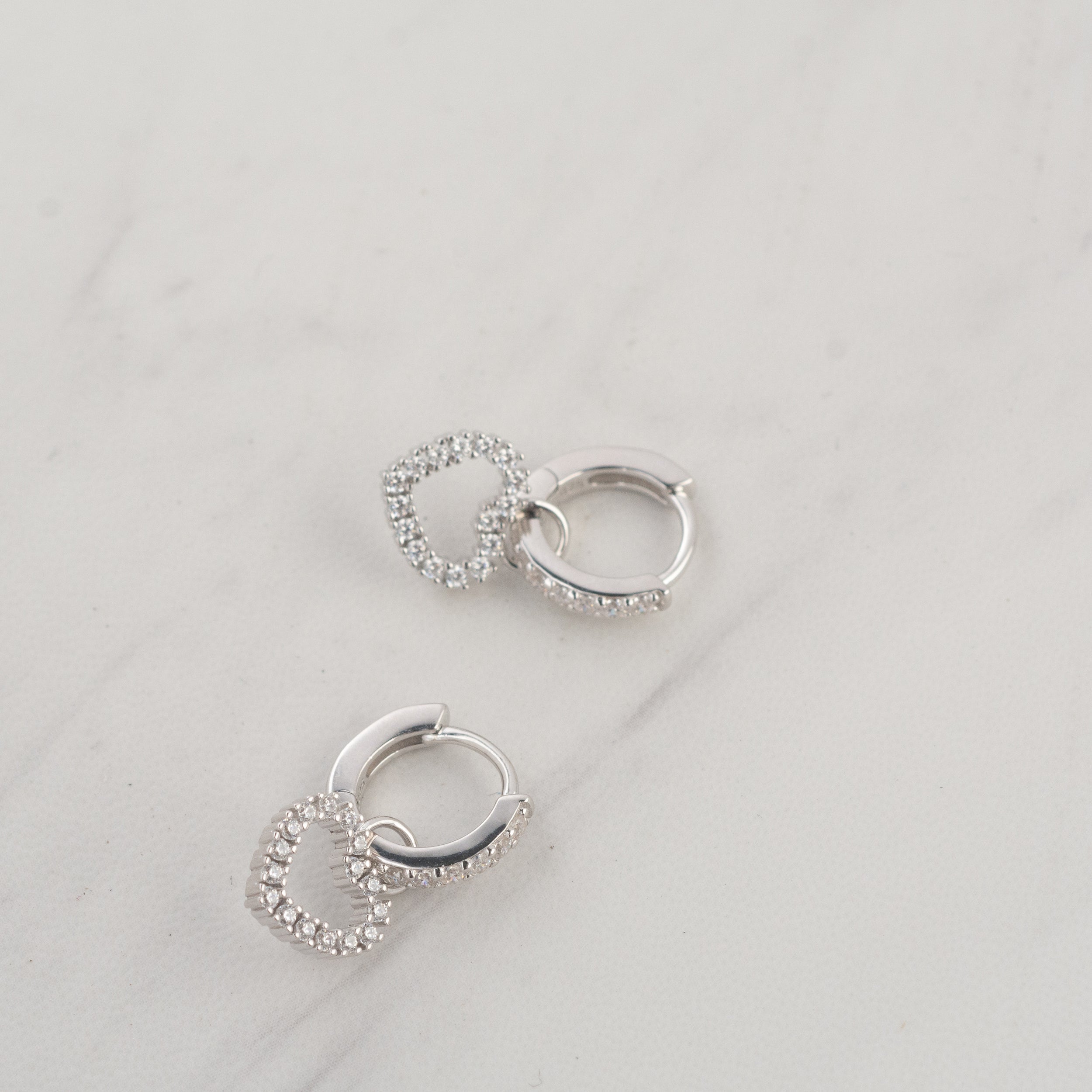 0.60 TCW Round Shape Moissanite Heart Huggies Earrings