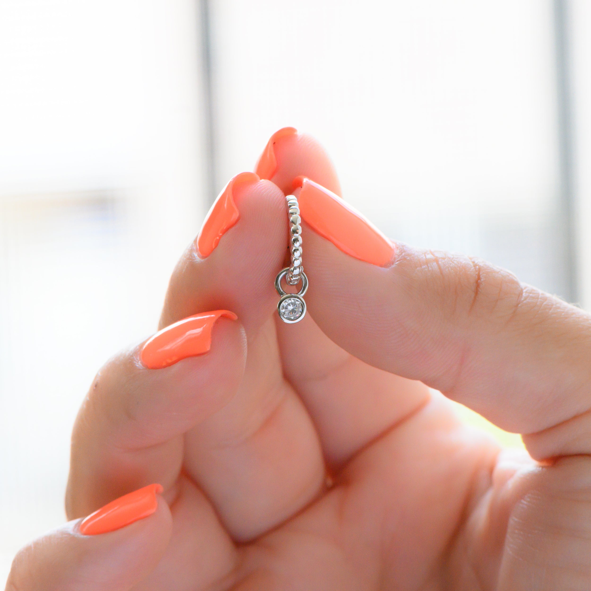 0.15 TCW Round Shape Moissanite Bezel Huggie Earrings