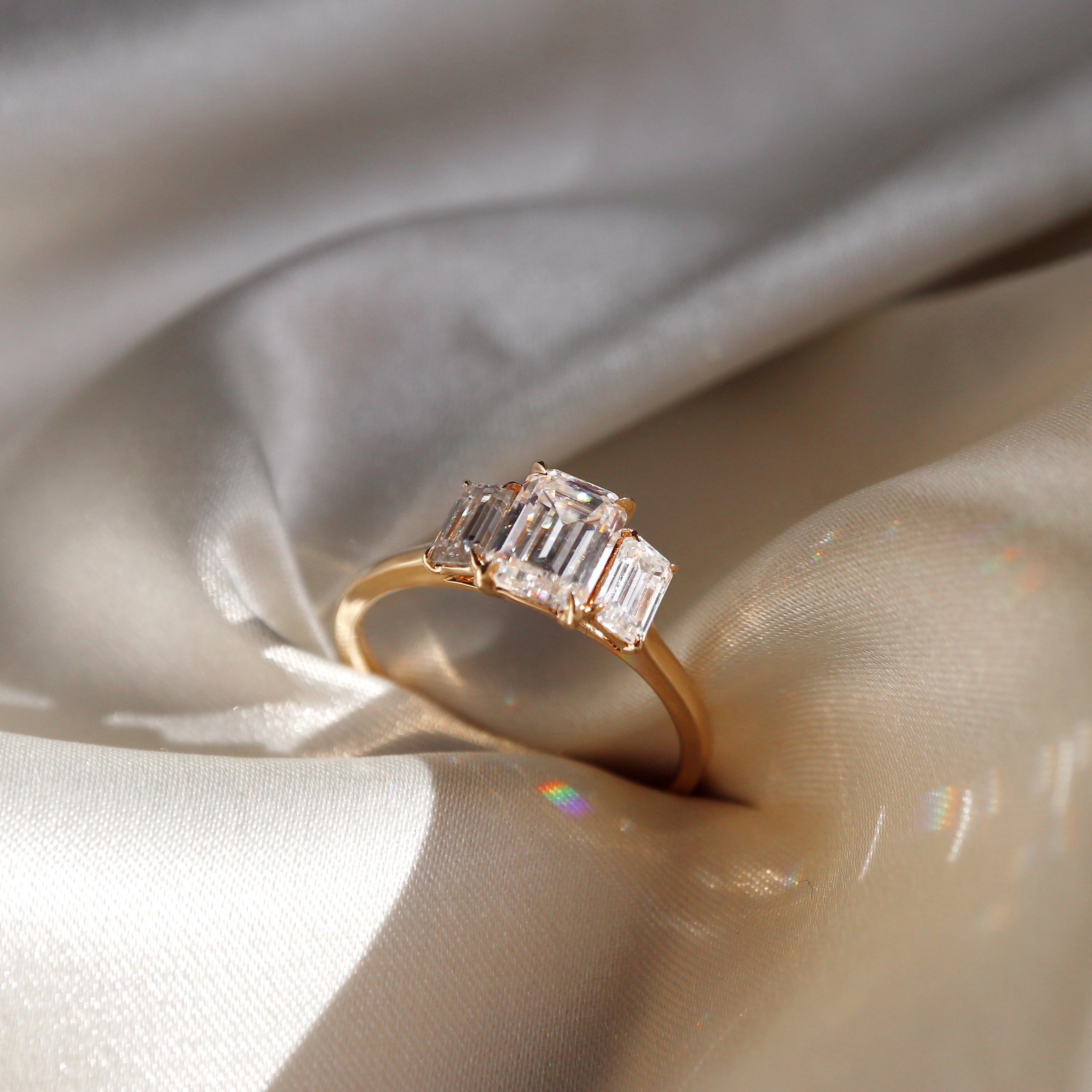 1.50 Carats Emerald Shape Three Stone Moissanite Engagement Ring