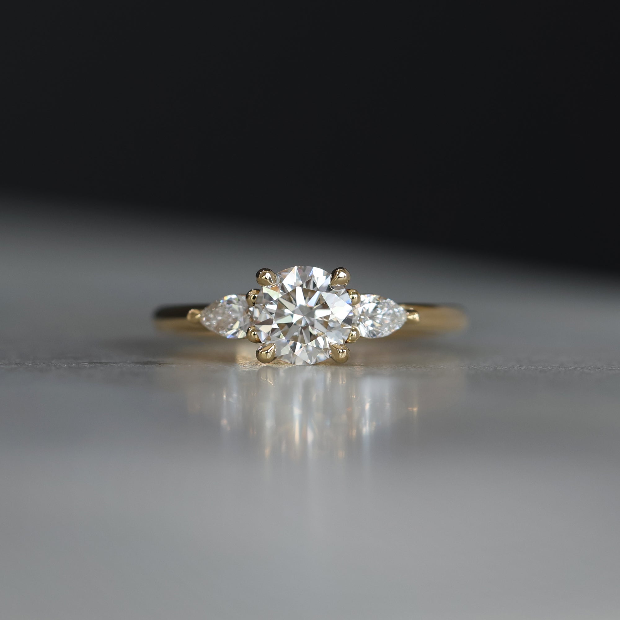 0.84 Carats Round Shape Moissanite Three Stone Engagement Ring