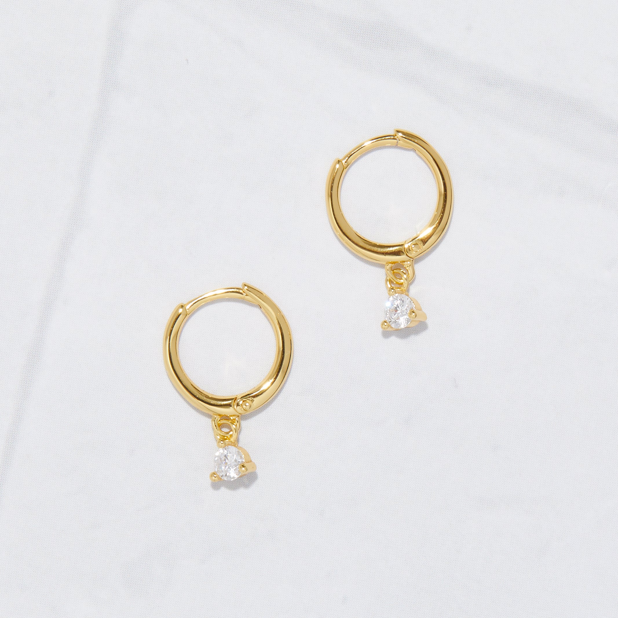 0.15 TCW Round Shape Moissanite Bezel Charm Huggies Earrings