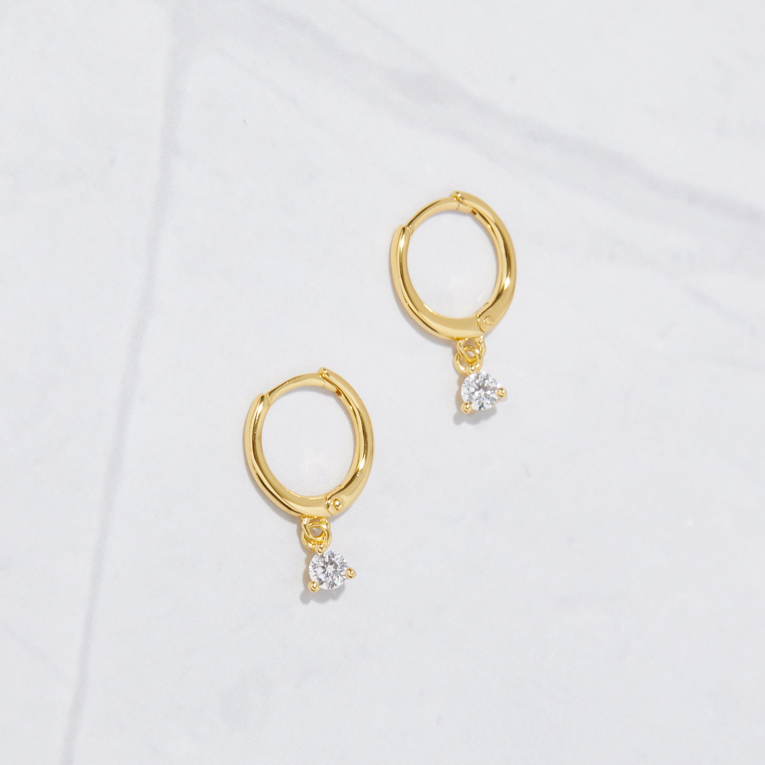 0.15 TCW Round Shape Moissanite Bezel Charm Huggies Earrings